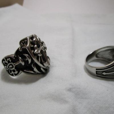 2 rings both size 14, both have crosses on them