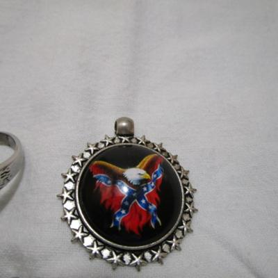 1 ring with eagle on it size 12, 2 pendants (one has an eagle with rebel flag, one is a cross with wings