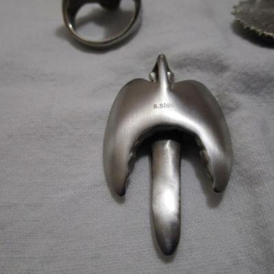 1 ring with eagle on it size 12, 2 pendants (one has an eagle with rebel flag, one is a cross with wings