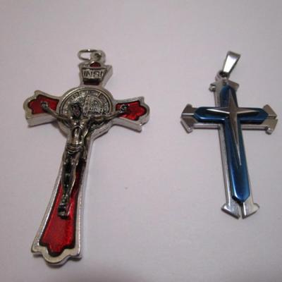 One cross silver & blue (2" x 1-1/4"), one red & silver crucifix (3" x 1-3/4")