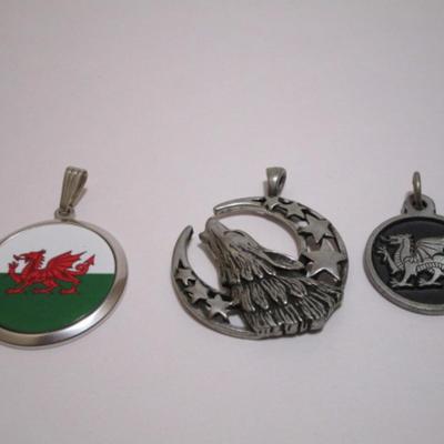 Silver dragon pendant is 1" diameter; red dragon is 1-1/4"; wolf is 1-1/2"