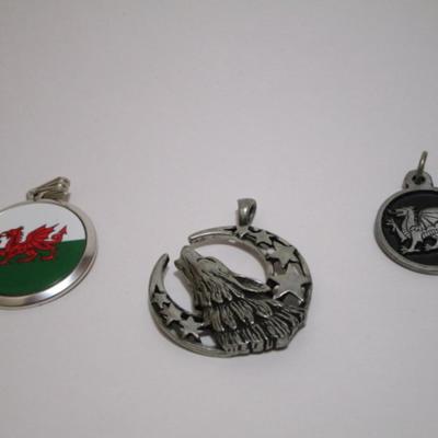 Silver dragon pendant is 1" diameter; red dragon is 1-1/4"; wolf is 1-1/2"