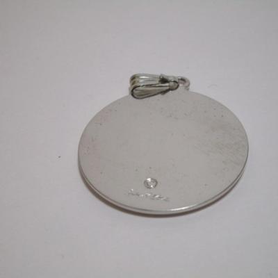 Silver dragon pendant is 1" diameter; red dragon is 1-1/4"; wolf is 1-1/2"
