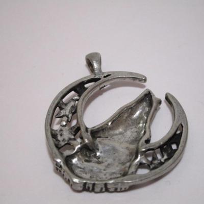 Silver dragon pendant is 1" diameter; red dragon is 1-1/4"; wolf is 1-1/2"