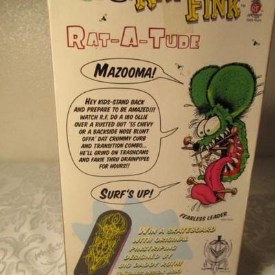Rat Fink figurine on a skateboard by Ed "Big Daddy" Roth