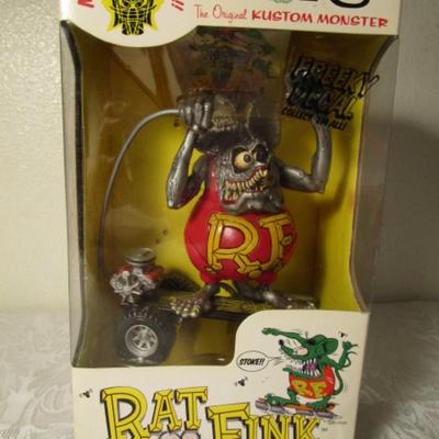 Rat Fink figurine on a skateboard by Ed "Big Daddy" Roth