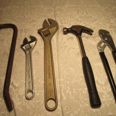 Hammer, channel lock pliers, 2 crescent wrenches, crowbar