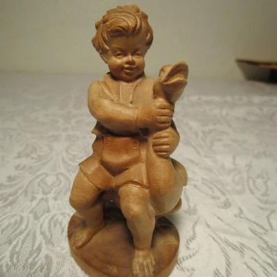 Hand-carved boy with goose
