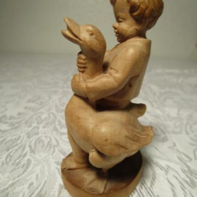 Hand-carved boy with goose