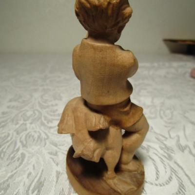 Hand-carved boy with goose
