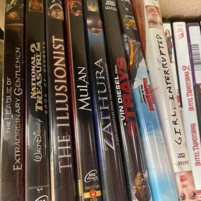 Netgear and a box full of DVDs