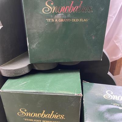 Snowbabies in boxes with tree shelf decor