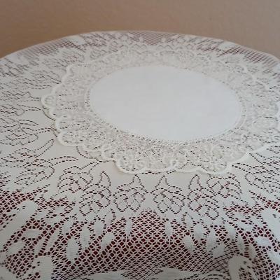 Plant stand - homemade small round table with tablecloth, lace, and Doiley