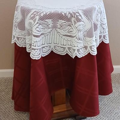 Plant stand - homemade small round table with tablecloth, lace, and Doiley