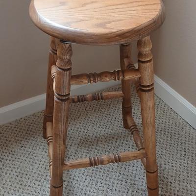 Rock Creek Woodworks Oak Swivel bar stool with arrangement in a basket