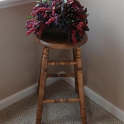 Rock Creek Woodworks Oak Swivel bar stool with arrangement in a basket