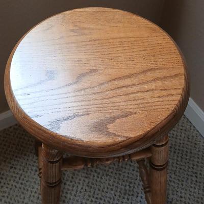 Rock Creek Woodworks Oak Swivel bar stool with arrangement in a basket