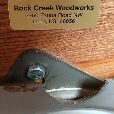 Rock Creek Woodworks Oak Swivel bar stool with arrangement in a basket