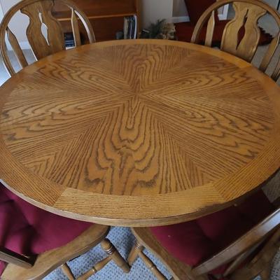 Round Pedestal top Cottage Oak Table and 4 Hoopback Cottage Oak Chairs with seat cushions