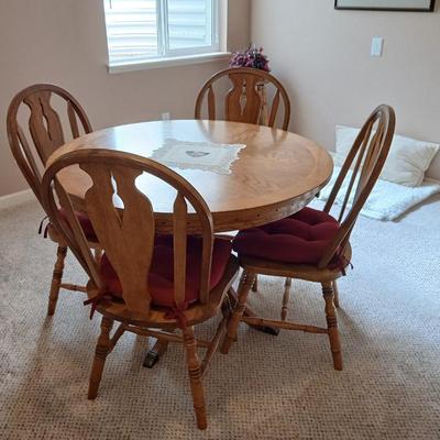 Round Pedestal top Cottage Oak Table and 4 Hoopback Cottage Oak Chairs with seat cushions
