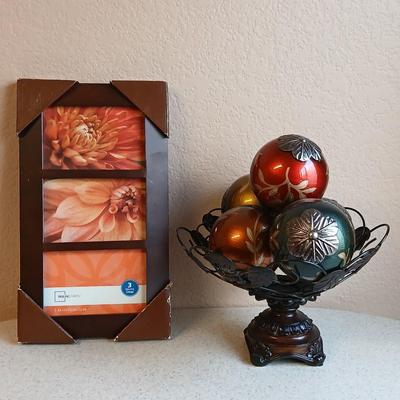 Metal decorative bowl with leaves and decorative balls inside with a brand-new picture frame