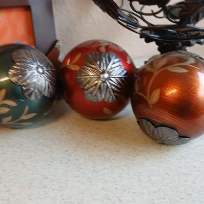 Metal decorative bowl with leaves and decorative balls inside with a brand-new picture frame