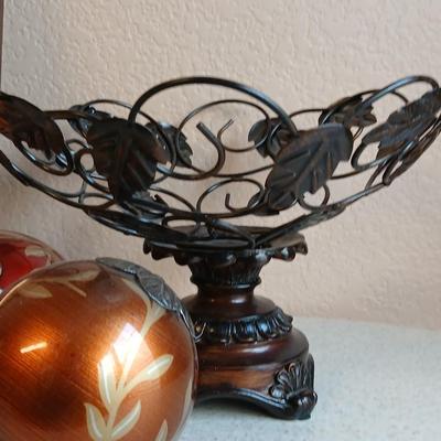 Metal decorative bowl with leaves and decorative balls inside with a brand-new picture frame