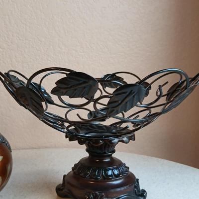 Metal decorative bowl with leaves and decorative balls inside with a brand-new picture frame