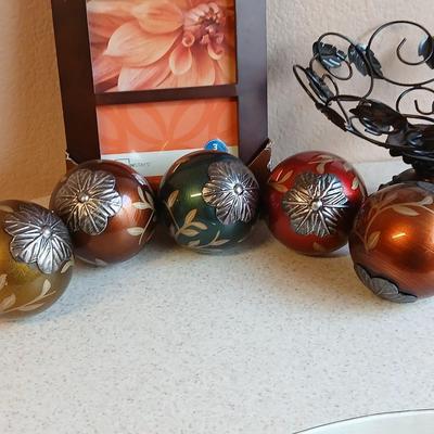 Metal decorative bowl with leaves and decorative balls inside with a brand-new picture frame