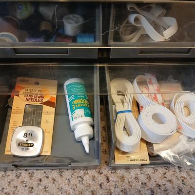 Multi drawer organizer with sewing items - thread - needles - elastic - and two sewing books