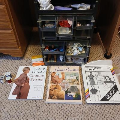 Multi drawer organizer with sewing items - thread - needles - elastic - and two sewing books