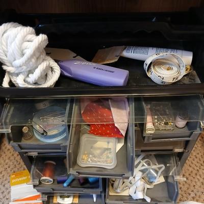 Multi drawer organizer with sewing items - thread - needles - elastic - and two sewing books