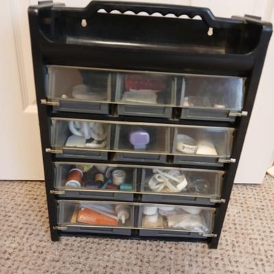 Multi drawer organizer with sewing items - thread - needles - elastic - and two sewing books