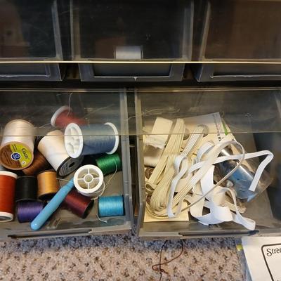 Multi drawer organizer with sewing items - thread - needles - elastic - and two sewing books