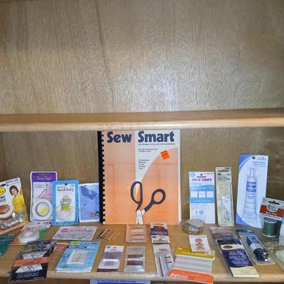 Sew Smart book with mostly new in the package sewing supplies