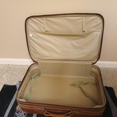 Jaguar luggage with a few small bags