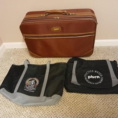 Jaguar luggage with a few small bags