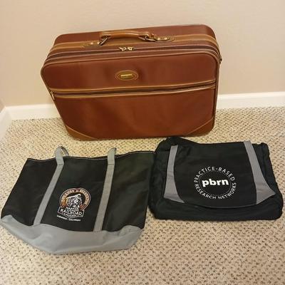 Jaguar luggage with a few small bags