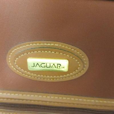 Jaguar luggage with a few small bags