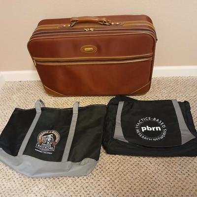 Jaguar luggage with a few small bags