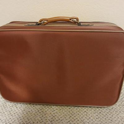 Jaguar luggage with a few small bags