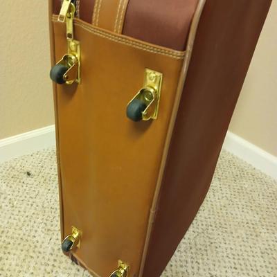 Jaguar luggage with a few small bags
