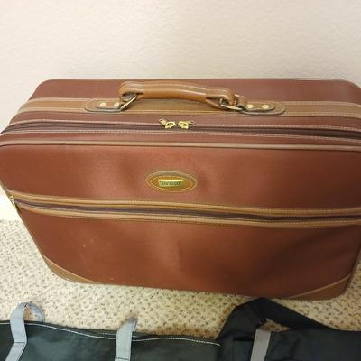 Jaguar luggage with a few small bags