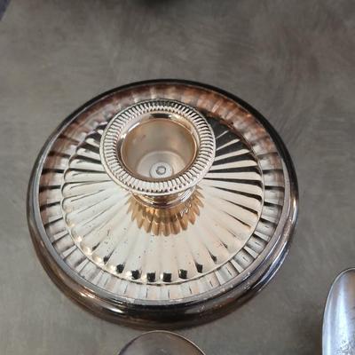 Assortment of vintage silverplate flatware and a candle holder with glass globe