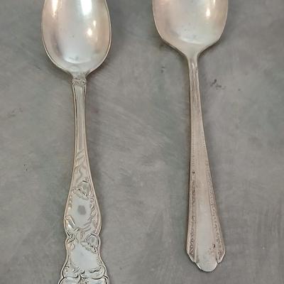 Assortment of vintage silverplate flatware and a candle holder with glass globe