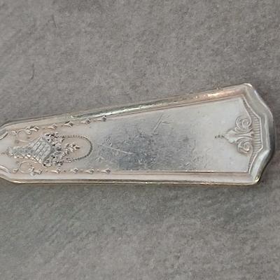 Assortment of vintage silverplate flatware and a candle holder with glass globe