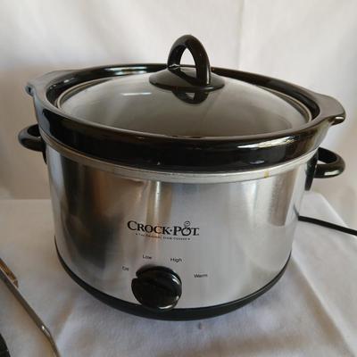 Three-piece Crock Pot the original slow cooker with some serving utensils