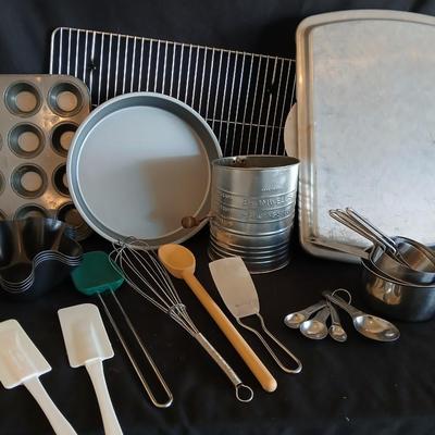 Baking pans - flour sifter - Measuring cups - cooling racks -whisk and more for baking