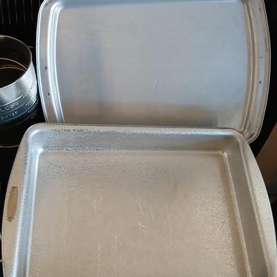 Baking pans - flour sifter - Measuring cups - cooling racks -whisk and more for baking