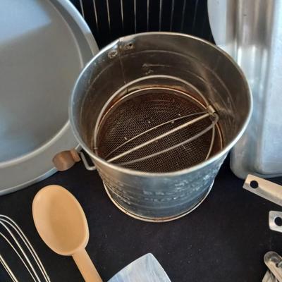 Baking pans - flour sifter - Measuring cups - cooling racks -whisk and more for baking
